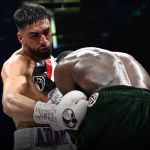 Clinical Azim stops Davies in eighth round